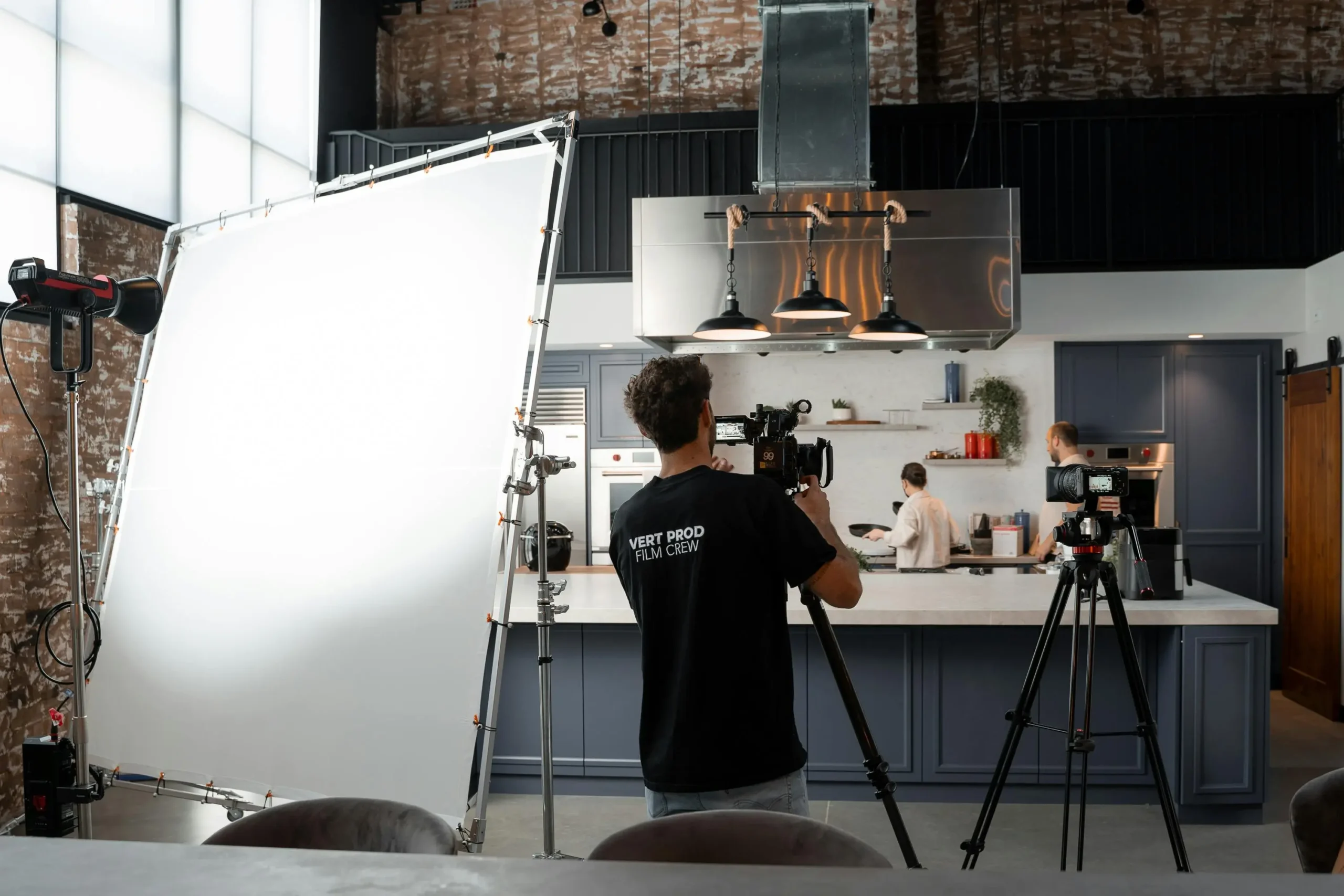 Filming in a modern kitchen setting.