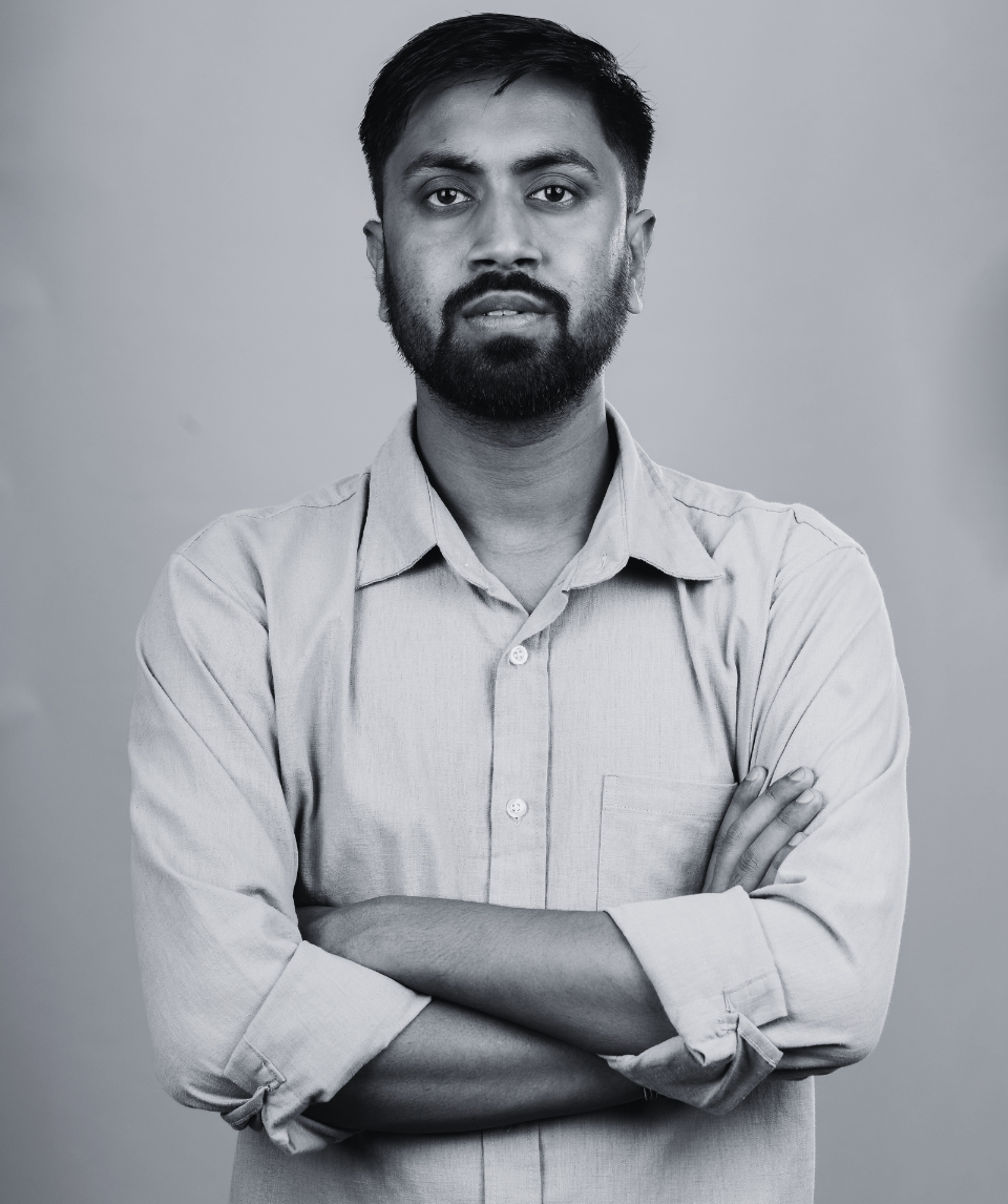 Man with arms crossed, serious expression